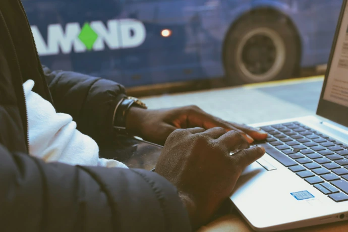 a person using a laptop computer on a table